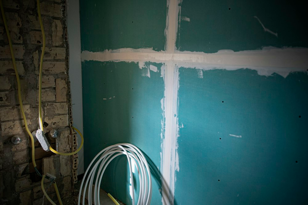 Sealed cable penetrations through a partition wall